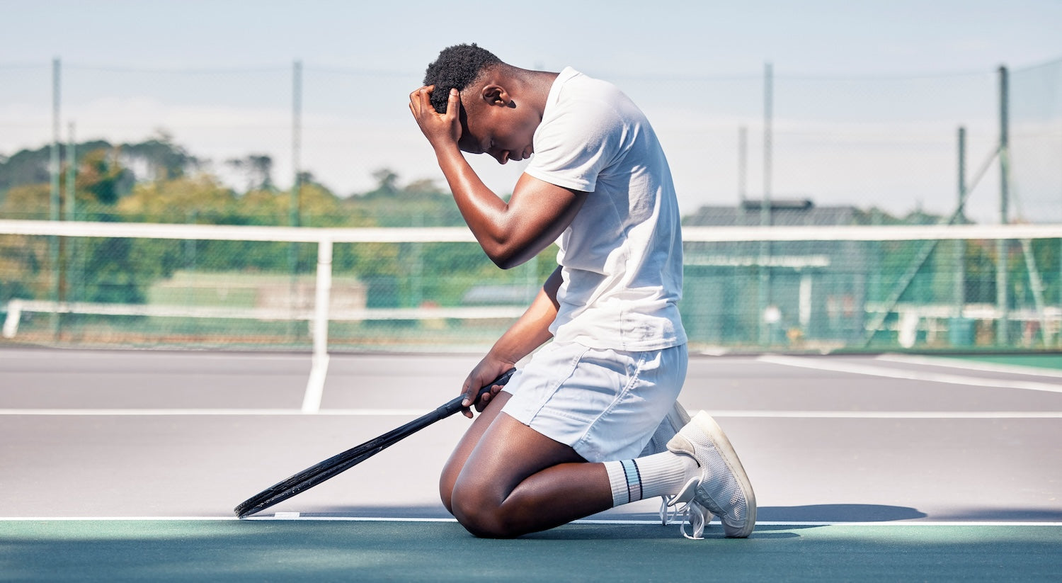 Tennis player tired on the court