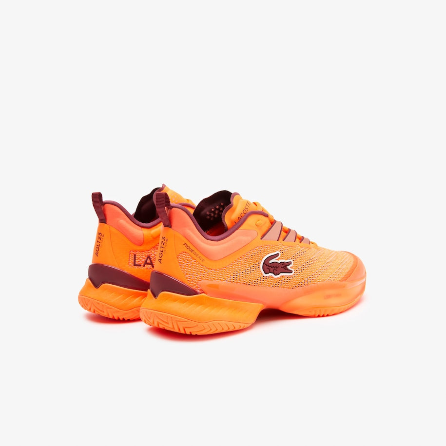 Stylish and dynamic Lacoste AG-LT23 Ultra Women's Tennis Shoes in Orange, featuring signature crocodile branding on the quarter